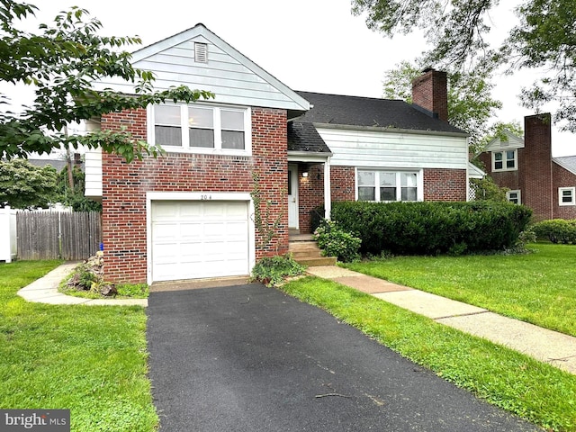 204 Opal Ave, Reading, PA 19606 - view of front facade featuring brick siding, a garage, asphalt driveway, and a chimney