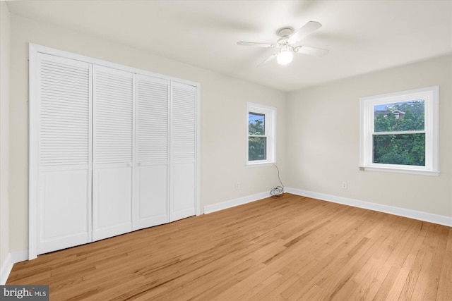 204 Opal Ave, Reading, PA 19606 - unfurnished bedroom featuring multiple windows, light wood finished floors, a closet, and a ceiling fan