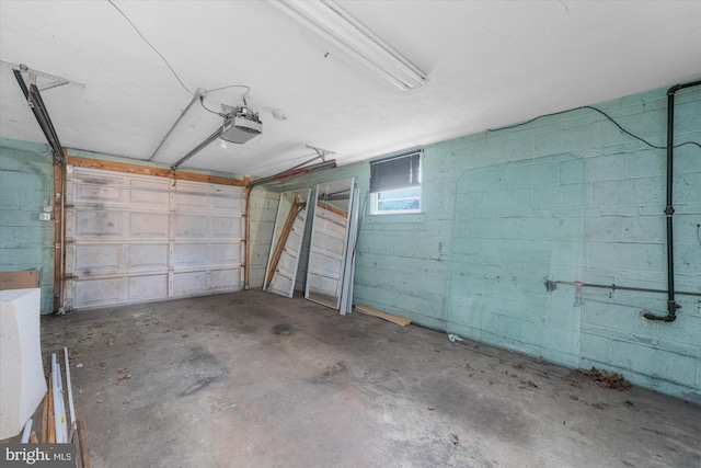 204 Opal Ave, Reading, PA 19606 - garage with concrete block wall and a garage door opener