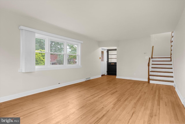 204 Opal Ave, Reading, PA 19606 - unfurnished living room featuring light wood-style flooring and stairs