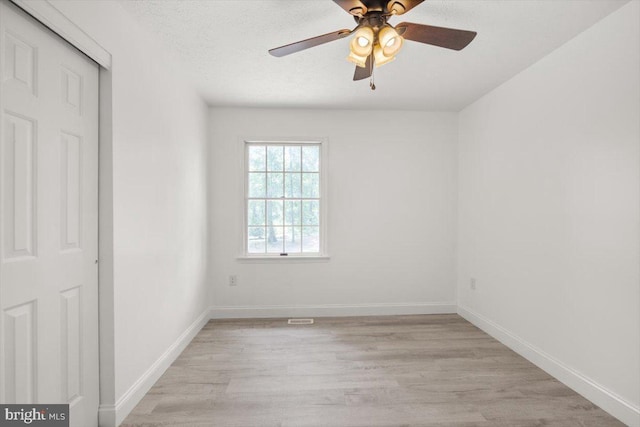 95 Arthur Burke Ln, Front Royal, VA 22630 - unfurnished bedroom with light wood-style flooring, a ceiling fan, and a closet