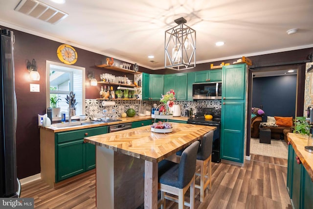 134 Catlett Mountain Rd, Front Royal, VA 22630 - kitchen featuring black range with electric cooktop, stainless steel microwave, butcher block counters, green cabinets, and ornamental molding