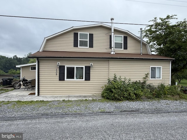 134 Catlett Mountain Rd, Front Royal, VA 22630 - view of side of property with a gambrel roof and a patio