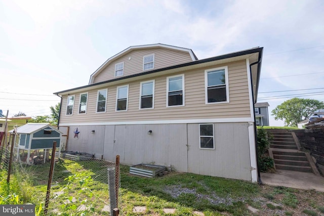 134 Catlett Mountain Rd, Front Royal, VA 22630 - back of property with a gambrel roof, a garden, and an outdoor structure