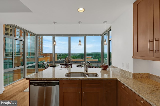 11990 Market St Unit 907, Reston, VA 20190 - kitchen with dishwasher, a peninsula, light stone counters, hanging light fixtures, and recessed lighting