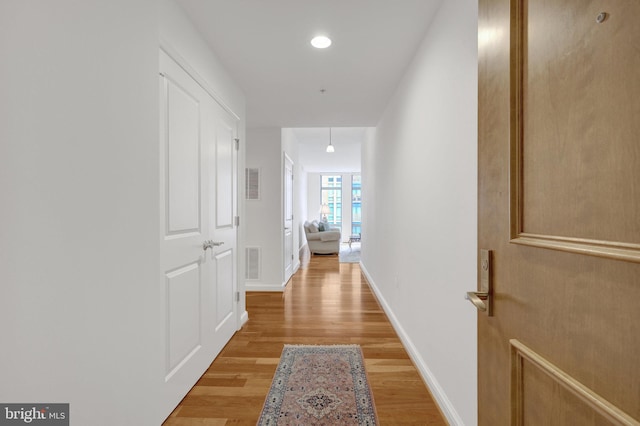 11990 Market St Unit 907, Reston, VA 20190 - corridor with light wood finished floors and baseboards
