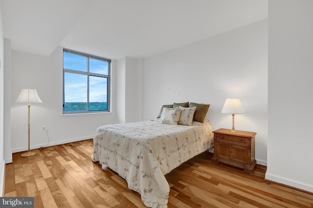11990 Market St Unit 907, Reston, VA 20190 - bedroom with light wood-style flooring and baseboards