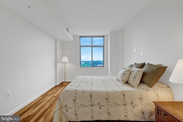 11990 Market St Unit 907, Reston, VA 20190 - bedroom featuring light wood finished floors and baseboards