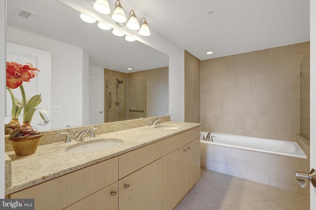 11990 Market St Unit 907, Reston, VA 20190 - bathroom featuring a stall shower, tile patterned flooring, double vanity, and a bath