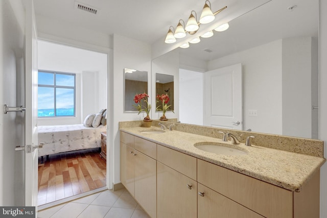 11990 Market St Unit 907, Reston, VA 20190 - ensuite bathroom with double vanity and tile patterned flooring