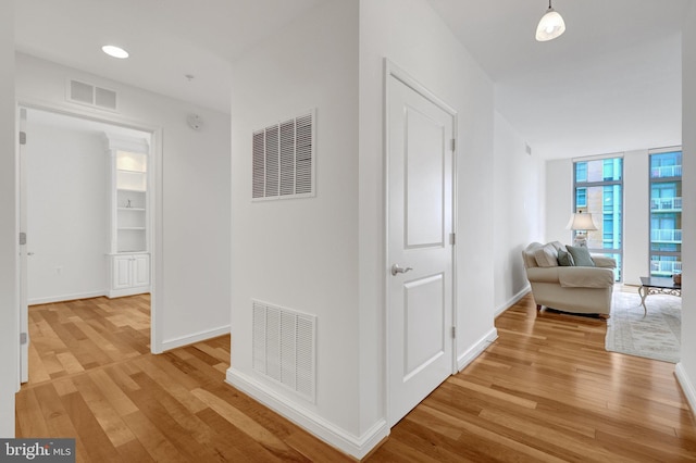 11990 Market St Unit 907, Reston, VA 20190 - hall featuring light wood-style floors and baseboards