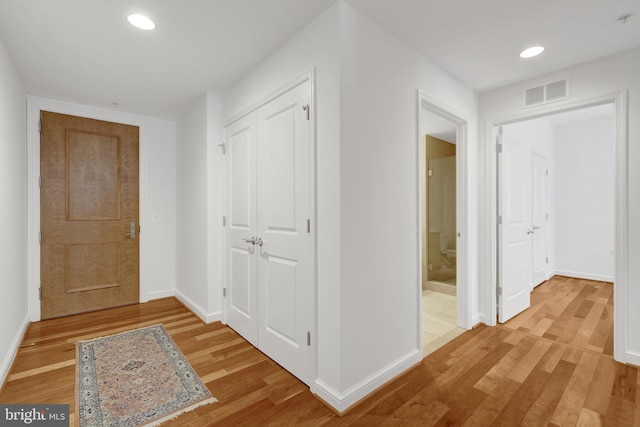 11990 Market St Unit 907, Reston, VA 20190 - hall with light wood-style flooring and recessed lighting