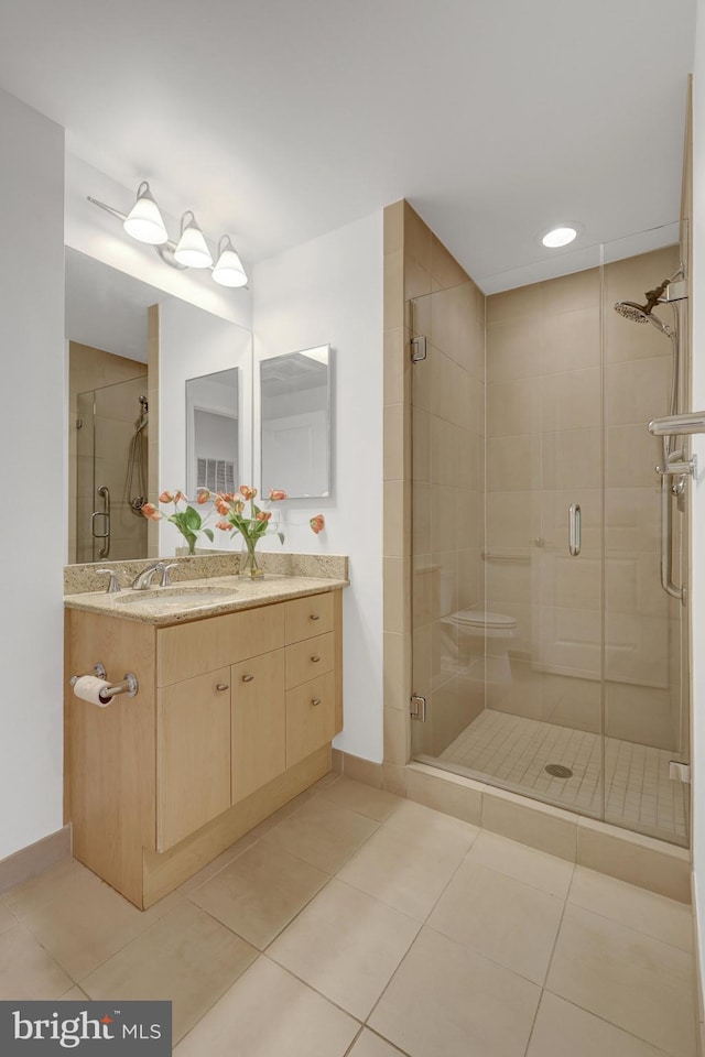 11990 Market St Unit 907, Reston, VA 20190 - bathroom with vanity, a stall shower, and tile patterned floors