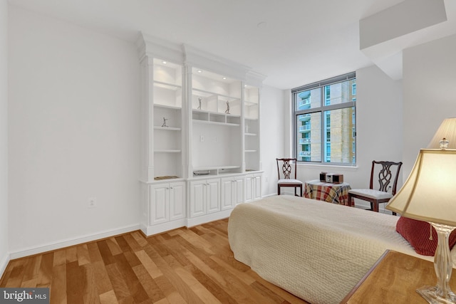 11990 Market St Unit 907, Reston, VA 20190 - bedroom with light wood finished floors and baseboards