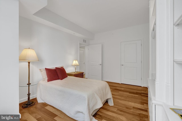 11990 Market St Unit 907, Reston, VA 20190 - bedroom with light wood-style floors