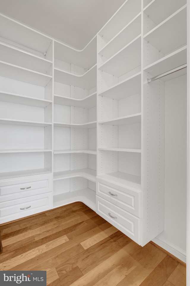 11990 Market St Unit 907, Reston, VA 20190 - spacious closet featuring light wood finished floors