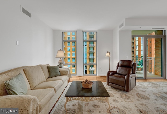 11990 Market St Unit 907, Reston, VA 20190 - living room with wood finished floors and floor to ceiling windows