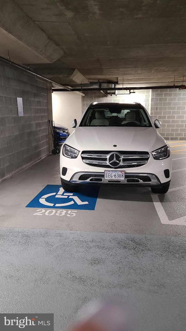 11990 Market St Unit 907, Reston, VA 20190 - parking garage featuring concrete block wall