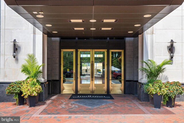 11990 Market St Unit 907, Reston, VA 20190 - entrance to property with french doors and brick siding