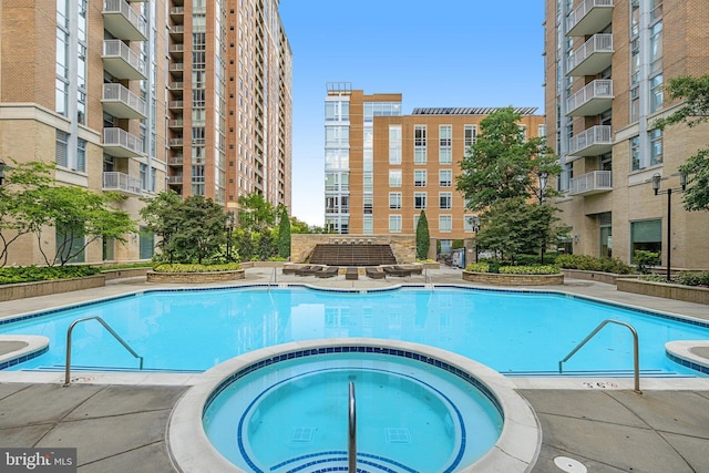 11990 Market St Unit 907, Reston, VA 20190 - view of swimming pool featuring a pool with connected hot tub