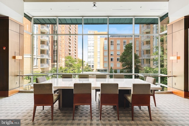 11990 Market St Unit 907, Reston, VA 20190 - carpeted dining room featuring a wall of windows and healthy amount of natural light