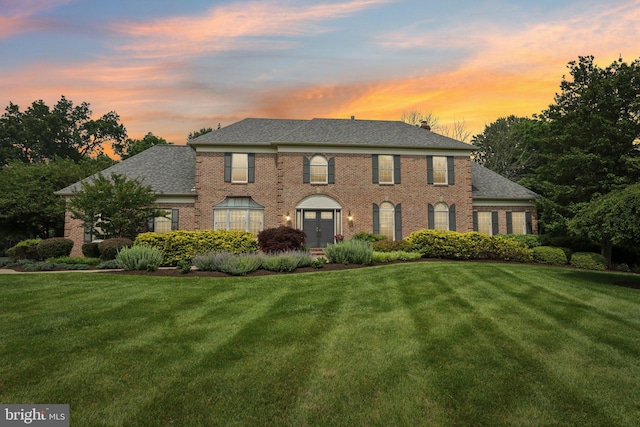 660 Casey Ln, West Chester, PA 19382 - view of front of house with brick siding, a lawn, and roof with shingles