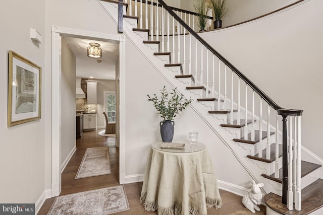 660 Casey Ln, West Chester, PA 19382 - staircase with wood finished floors and baseboards