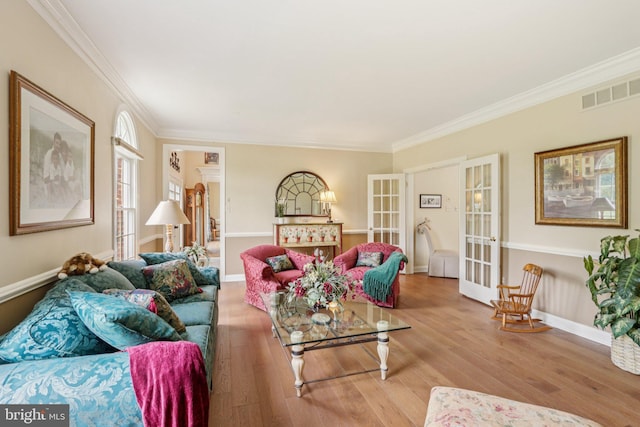 660 Casey Ln, West Chester, PA 19382 - living area featuring crown molding, wood finished floors, and french doors