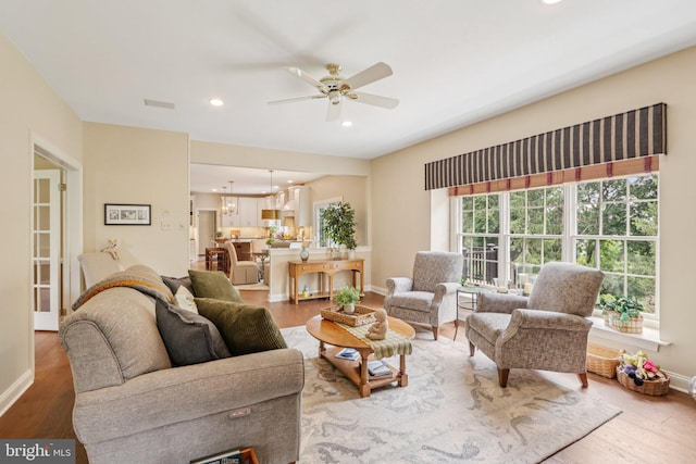 660 Casey Ln, West Chester, PA 19382 - living area featuring wood finished floors, a ceiling fan, recessed lighting, and a chandelier