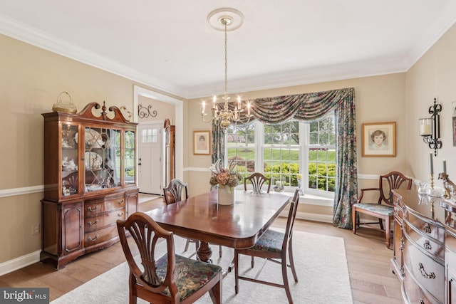 660 Casey Ln, West Chester, PA 19382 - dining space featuring a chandelier, light wood-style flooring, and ornamental molding