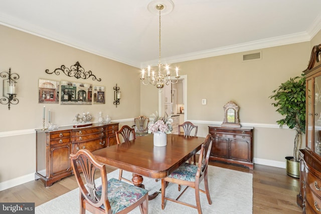 660 Casey Ln, West Chester, PA 19382 - dining space featuring a chandelier, light wood-type flooring, and ornamental molding