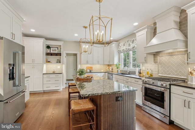 660 Casey Ln, West Chester, PA 19382 - kitchen featuring premium appliances, custom exhaust hood, open shelves, wood finished floors, and recessed lighting
