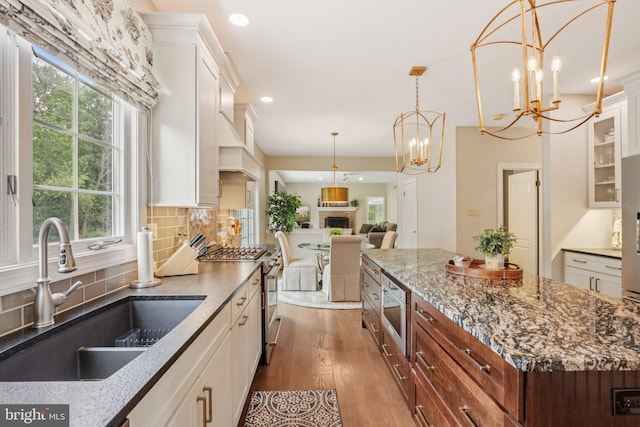 660 Casey Ln, West Chester, PA 19382 - kitchen with stainless steel appliances, white cabinetry, wood finished floors, and recessed lighting