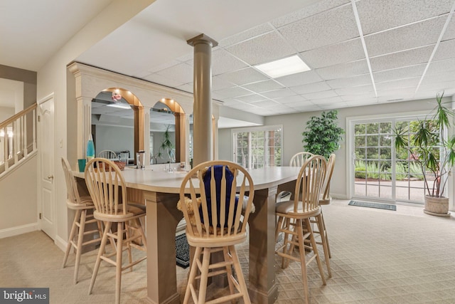 660 Casey Ln, West Chester, PA 19382 - dining space with light carpet, ornate columns, healthy amount of natural light, and a paneled ceiling