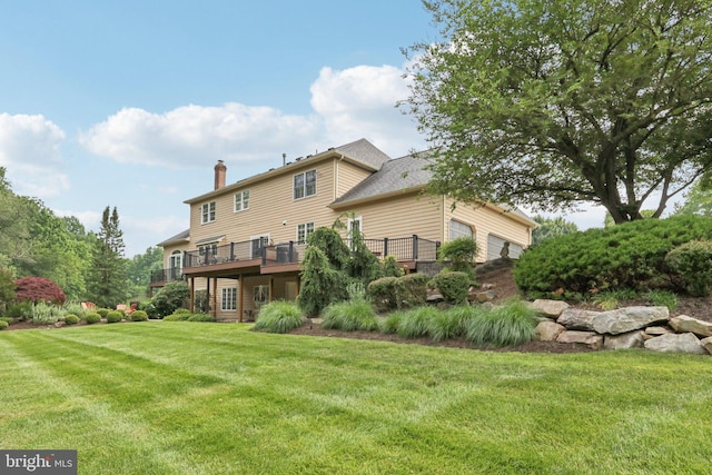 660 Casey Ln, West Chester, PA 19382 - rear view of house featuring a yard, a chimney, and a deck