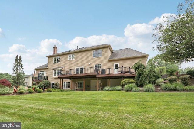 660 Casey Ln, West Chester, PA 19382 - rear view of house featuring a chimney, a lawn, and a wooden deck