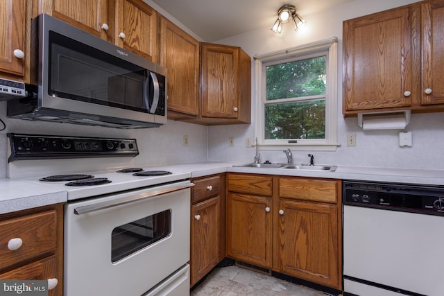237 Cliff Ln, Elizabethtown, PA 17022 - kitchen featuring white appliances, brown cabinets, and light countertops