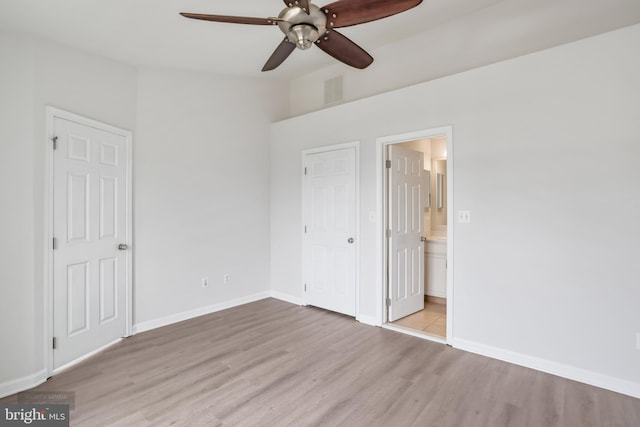 25154 Monteith Ter, Chantilly, VA 20152 - unfurnished bedroom with wood finished floors, lofted ceiling, connected bathroom, and ceiling fan
