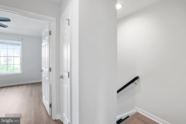 25154 Monteith Ter, Chantilly, VA 20152 - hallway with wood finished floors and an upstairs landing