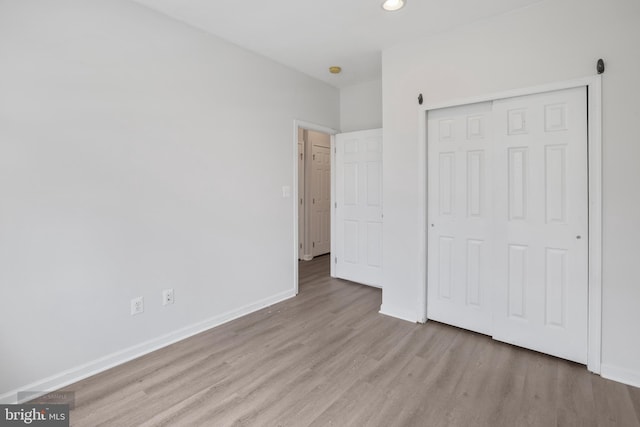 25154 Monteith Ter, Chantilly, VA 20152 - unfurnished bedroom featuring wood finished floors, a closet, and recessed lighting