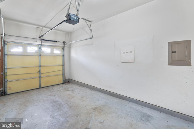 25154 Monteith Ter, Chantilly, VA 20152 - garage featuring electric panel and a garage door opener