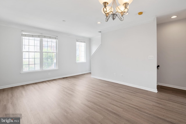 25154 Monteith Ter, Chantilly, VA 20152 - spare room with crown molding, wood finished floors, a chandelier, and recessed lighting