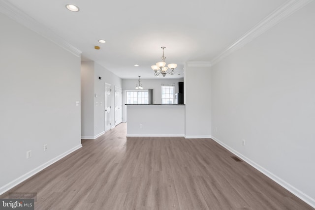 25154 Monteith Ter, Chantilly, VA 20152 - unfurnished living room with a chandelier, ornamental molding, wood finished floors, and recessed lighting