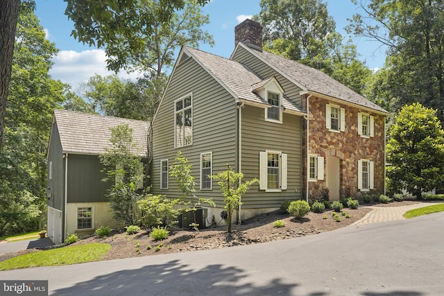 4250 Fretz Mill Rd, New Hope, PA 18938 - colonial home featuring stone siding and a chimney