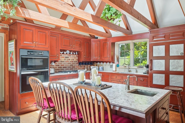 4250 Fretz Mill Rd, New Hope, PA 18938 - kitchen with light stone counters, a kitchen island with sink, and tasteful backsplash