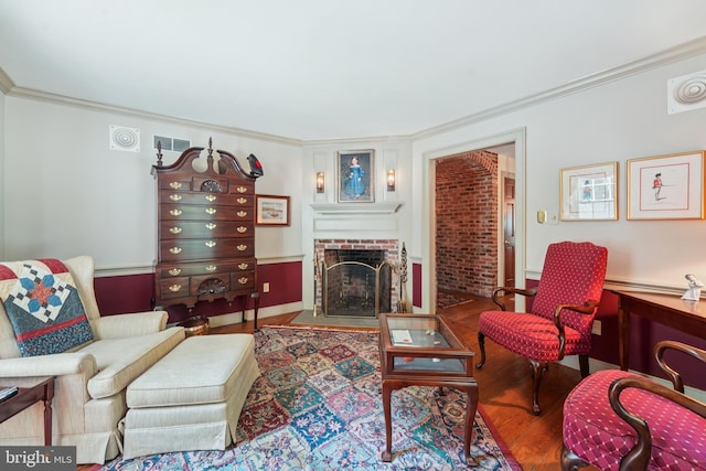 4250 Fretz Mill Rd, New Hope, PA 18938 - living area featuring a brick fireplace, ornamental molding, and wood finished floors