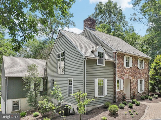 4250 Fretz Mill Rd, New Hope, PA 18938 - view of side of home with a chimney and stone siding