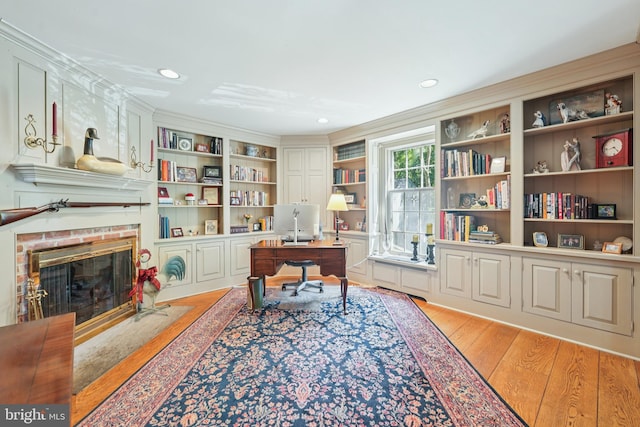 4250 Fretz Mill Rd, New Hope, PA 18938 - home office featuring light wood finished floors, recessed lighting, a brick fireplace, and ornamental molding