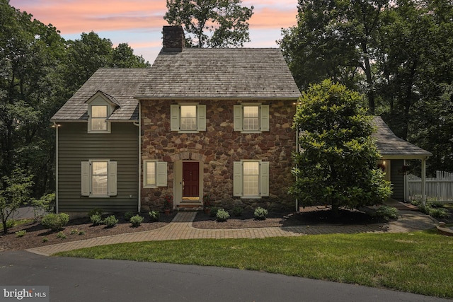 4250 Fretz Mill Rd, New Hope, PA 18938 - colonial inspired home featuring stone siding, a chimney, and a front yard