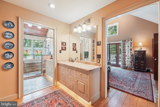 4250 Fretz Mill Rd, New Hope, PA 18938 - bathroom featuring wood finished floors, healthy amount of natural light, vanity, connected bathroom, and recessed lighting